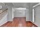 Elegant foyer showcasing hardwood floors and an open view to the dining room at 3805 Roxwood Park Dr, Buford, GA 30518