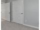 The image features carpeted hallway with white doors and baseboards at 3805 Roxwood Park Dr, Buford, GA 30518