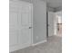 The image features carpeted hallway with white doors and baseboards at 3805 Roxwood Park Dr, Buford, GA 30518