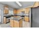 The modern kitchen includes granite counters, stainless appliances, and a practical kitchen island at 3805 Roxwood Park Dr, Buford, GA 30518