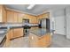 Bright kitchen features granite countertops, stainless steel appliances and an island at 3805 Roxwood Park Dr, Buford, GA 30518