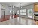 Charming eat-in kitchen features an island, granite counters, stainless appliances and large windows at 3805 Roxwood Park Dr, Buford, GA 30518