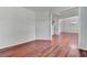 Spacious living room featuring hardwood floors and view into dining room at 3805 Roxwood Park Dr, Buford, GA 30518