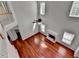 Open living room with hardwood floors, a fireplace, tall ceilings, and bright windows at 3805 Roxwood Park Dr, Buford, GA 30518