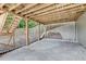 Covered patio with wooden beams and steps leading to the backyard at 3805 Roxwood Park Dr, Buford, GA 30518