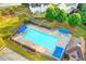Aerial shot showcases the community pool with plenty of seating and well-kept landscaping at 3805 Roxwood Park Dr, Buford, GA 30518