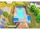 Aerial shot of a community pool with ample seating, surrounded by lush landscaping at 3805 Roxwood Park Dr, Buford, GA 30518