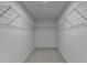 Walk-in closet with shelving for storage and organization with gray carpet at 3805 Roxwood Park Dr, Buford, GA 30518