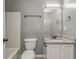 Bathroom features a granite vanity, updated fixtures, and shower with tub at 459 Bakers Bridge Cir, Douglasville, GA 30134