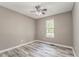 Cozy bedroom with light grey flooring and window at 459 Bakers Bridge Cir, Douglasville, GA 30134