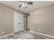 Bedroom with gray walls, wood-look floors, closet, and white trim at 459 Bakers Bridge Cir, Douglasville, GA 30134