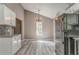 Kitchen and dining area offers modern appliances and light grey flooring at 459 Bakers Bridge Cir, Douglasville, GA 30134