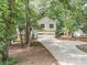 Charming two-story home with a two-car garage, a front porch, and a driveway at 459 Bakers Bridge Cir, Douglasville, GA 30134