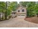 Charming two-story home with a two-car garage, a front porch, and a driveway at 459 Bakers Bridge Cir, Douglasville, GA 30134