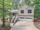 Charming two-story home with a two-car garage, a front porch, and a driveway at 459 Bakers Bridge Cir, Douglasville, GA 30134
