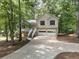 Charming two-story home with a two-car garage, a front porch, and a driveway at 459 Bakers Bridge Cir, Douglasville, GA 30134
