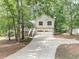 Charming two-story home with a two-car garage, a front porch, and a driveway at 459 Bakers Bridge Cir, Douglasville, GA 30134