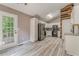 Modern kitchen featuring stainless steel appliances, white cabinetry, and hardwood floors at 459 Bakers Bridge Cir, Douglasville, GA 30134