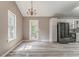 Bright kitchen and dining area with hardwood floors and stainless steel appliances at 459 Bakers Bridge Cir, Douglasville, GA 30134