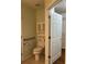 Full bathroom featuring toilet and vanity with storage at 802 Village Pl, Loganville, GA 30052
