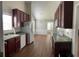 Traditional kitchen with dark wood cabinets and appliances at 802 Village Pl, Loganville, GA 30052