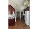 Traditional kitchen with dark wood cabinets and appliances at 802 Village Pl, Loganville, GA 30052