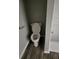 Bathroom including a toilet and shower featuring new flooring at 125 Toccoa Rd, Carrollton, GA 30116