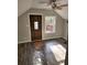 Sun-filled bedroom featuring new flooring, decorative front door and exterior deck at 125 Toccoa Rd, Carrollton, GA 30116