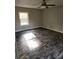 Bedroom featuring a window providing natural light and ceiling fan at 125 Toccoa Rd, Carrollton, GA 30116