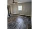 Bedroom featuring a window providing natural light and ceiling fan at 125 Toccoa Rd, Carrollton, GA 30116