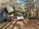 Carport providing covered parking next to a home with wood-look siding at 125 Toccoa Rd, Carrollton, GA 30116