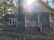 Charming exterior view of a two-story home with a stone chimney at 125 Toccoa Rd, Carrollton, GA 30116