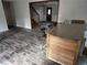 Open-concept living room with hardwood flooring, dark wood trim and view of front door at 125 Toccoa Rd, Carrollton, GA 30116