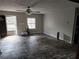 Living room with two windows, dark door, new flooring, and neutral walls at 125 Toccoa Rd, Carrollton, GA 30116