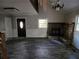 Cozy living room with stone fireplace, window, and dark flooring at 125 Toccoa Rd, Carrollton, GA 30116