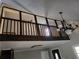 Cozy living room with an chandelier, railing, ceiling fan, and natural light at 125 Toccoa Rd, Carrollton, GA 30116