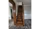 Wooden staircase leading to upper floor with grey walls and modern flooring at 125 Toccoa Rd, Carrollton, GA 30116