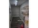 Utility room with shelving, water heater and modern flooring at 125 Toccoa Rd, Carrollton, GA 30116