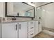 Bathroom featuring dual sinks, granite countertops, and a glass shower at 461 Barnwood Dr, Rockmart, GA 30153