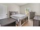 Bright bedroom with wood-accented furniture, a comfortable bed, and a window providing natural light at 461 Barnwood Dr, Rockmart, GA 30153