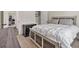 Cozy bedroom features neutral tones, a comfortable bed, and easy access to closet and hallway at 461 Barnwood Dr, Rockmart, GA 30153