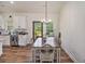 Adjacent to the kitchen, the dining area features an elegant table and natural light, perfect for Gathering meals at 461 Barnwood Dr, Rockmart, GA 30153