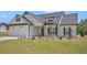 Beautiful single-Gathering home with a two-car garage, craftsman features, and well-manicured lawn at 461 Barnwood Dr, Rockmart, GA 30153