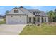 Beautiful single-Gathering home with a two-car garage, craftsman features, and well-manicured lawn at 461 Barnwood Dr, Rockmart, GA 30153