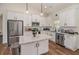 Modern kitchen featuring white cabinets, granite countertops, stainless steel appliances, and a functional center island at 461 Barnwood Dr, Rockmart, GA 30153
