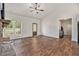 Inviting living room with a stone fireplace, vaulted ceiling, wood floors, and natural light at 461 Barnwood Dr, Rockmart, GA 30153