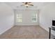 Large bedroom with trey ceilings, carpeted floors, a ceiling fan, and plenty of natural light at 461 Barnwood Dr, Rockmart, GA 30153