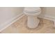 Close up of a toilet with tile flooring at 461 Barnwood Dr, Rockmart, GA 30153