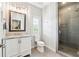 Contemporary bathroom with a glass shower enclosure, white vanity, and tiled floor at 502 Abbington River Ln, Atlanta, GA 30339