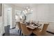 Dining room featuring neutral colors and modern pendant lighting at 502 Abbington River Ln, Atlanta, GA 30339